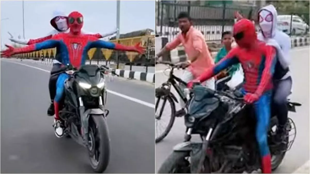 दिल्ली की सड़कों पर स्पाइडरमैन बन बॉयफ्रेंड और गर्लफ्रेंड  बाइक में घूमते नजर आये ,पुलिस ने काटा चालान