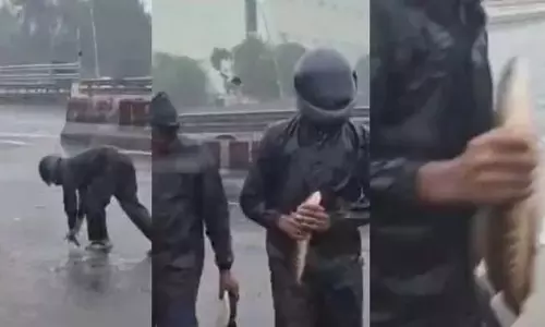 हिलती चेन्नई.. GST रोड पर मछली पकड़ता पुलिसकर्मी