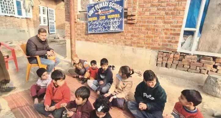 J&K: Students forced to study in the open in the cold