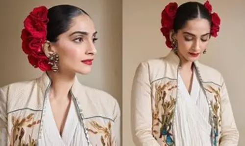 Sonam Kapoor की लेटेस्ट लुक वायरल, लंबी जैकेट के साथ व्हाइट ड्रेस पहनी