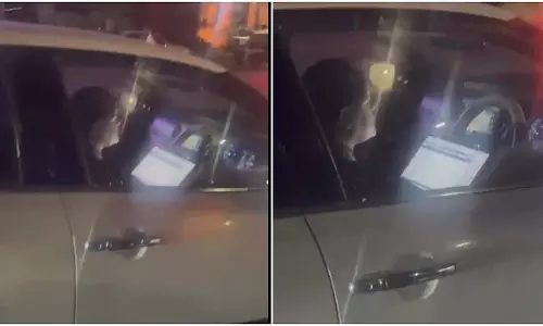 गाड़ी चलाते समय लैपटॉप इस्तेमाल करती पकड़ी गई महिला, लगा जुर्माना, VIDEO गाड़ी चलाते समय लैपटॉप इस्तेमाल करती पकड़ी गई महिला, लगा जुर्माना, VIDEO