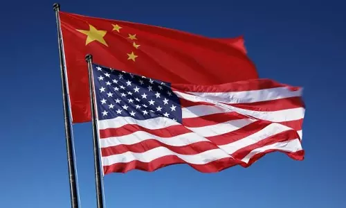 USA : चीनी अधिकारियों पर वीजा प्रतिबंध, क्या है कारण?