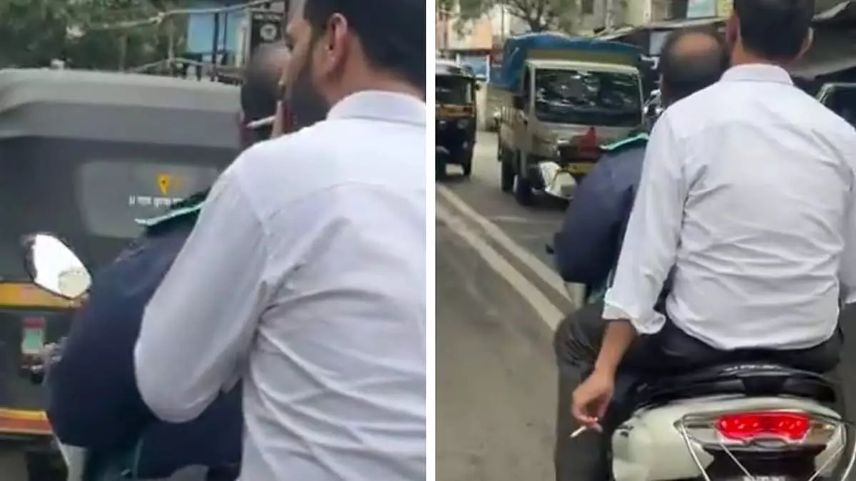 Pune : कोथरूड में चलती स्कूटी पर पीछे बैठकर सिगरेट पीते पकड़ा गया शख्स Pune : कोथरूड में चलती स्कूटी पर पीछे बैठकर सिगरेट पीते पकड़ा गया शख्स