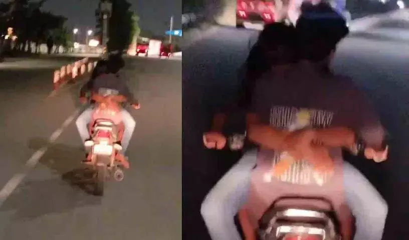 Hyderabad में चलती बाइक पर रोमांस करते कपल.. वीडियो वायरल Hyderabad में चलती बाइक पर रोमांस करते कपल.. वीडियो वायरल