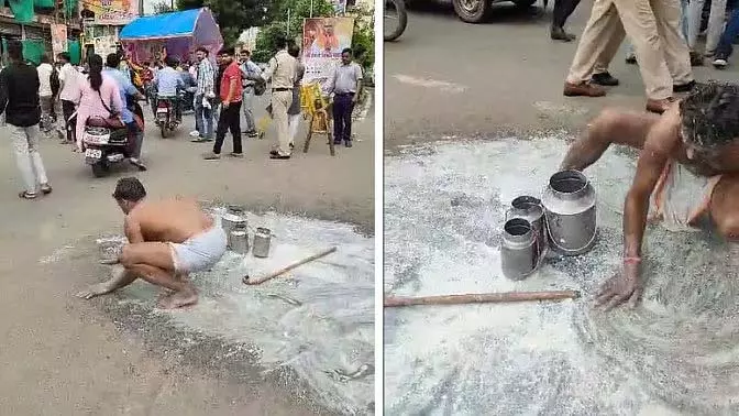 सर्विस में देरी से नाराज़ दूधवाले का अनोखा प्रदर्शन, सड़क पर दूध फैलाया सर्विस में देरी से नाराज़ दूधवाले का अनोखा प्रदर्शन, सड़क पर दूध फैलाया
