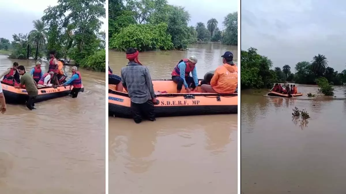 MP : छतरपुर में सिंघारी नदी में बाढ़ से स्थानीय लोगों को नावों से बचाया गया MP : छतरपुर में सिंघारी नदी में बाढ़ से स्थानीय लोगों को नावों से बचाया गया