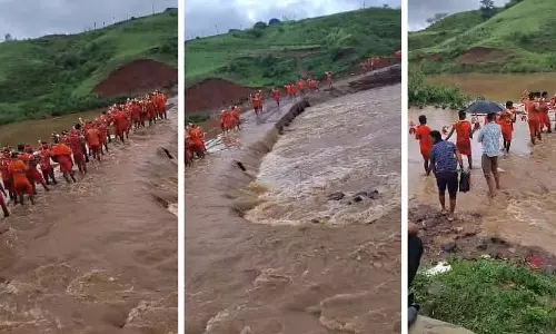 MP : डिंडोरी में तेज बहाव के बीच उफनती नदी में संतुलन बनाते दिखे 30 से अधिक कांवड़िये