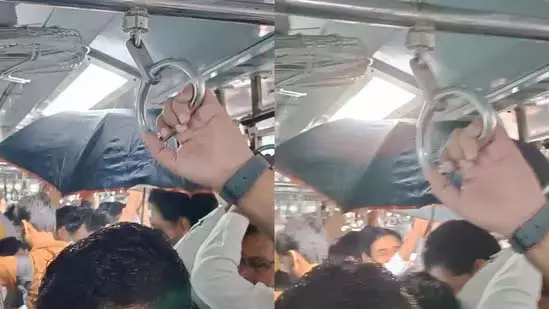 एसी कोच में छाता लिए खड़े व्यक्ति ने उड़ाए यात्रियों के होश एसी कोच में छाता लिए खड़े व्यक्ति ने उड़ाए यात्रियों के होश