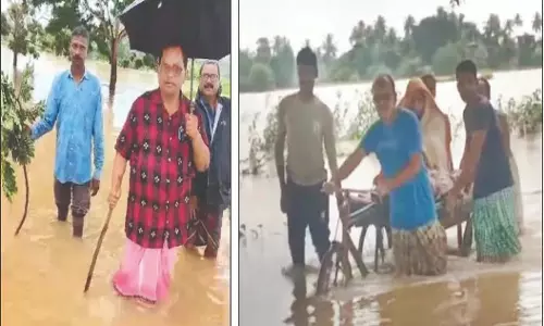 Odisha : डॉक्टर केंद्रपाड़ा में गर्भवती महिला को बचाने के लिए बाढ़ के पानी में चले