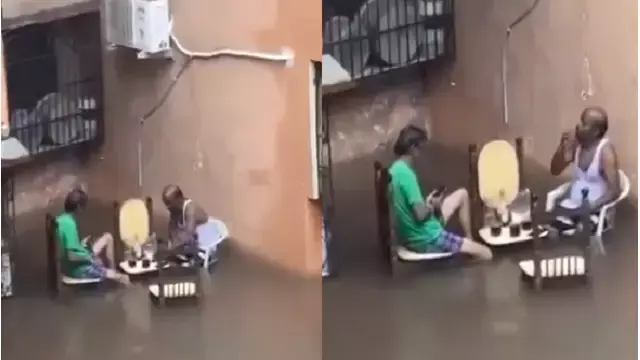 Mumbai की बाढ़ग्रस्त सड़क पर दो लोगों ने शराब पीने के लिए लगाई टेबल, वीडियो वायरल