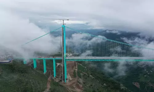 China के हुआजियांग ब्रिज ने यात्रा का समय 2 घंटे से घटाकर 2 मिनट कर दिया