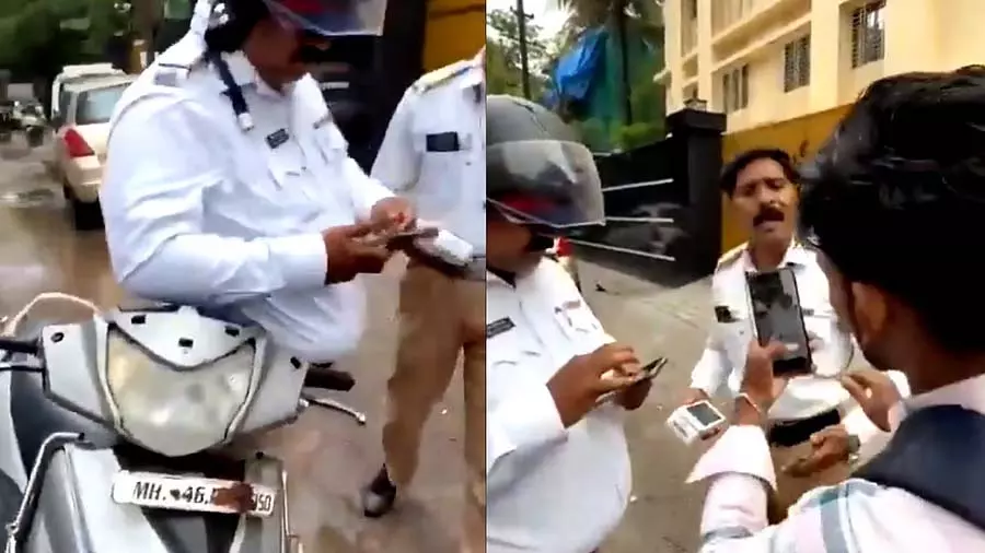 हेलमेट और नंबर प्लेट को लेकर बहस के बाद स्कूटर सवार और ट्रैफिक पुलिसकर्मी पर जुर्माना लगाया हेलमेट और नंबर प्लेट को लेकर बहस के बाद स्कूटर सवार और ट्रैफिक पुलिसकर्मी पर जुर्माना लगाया
