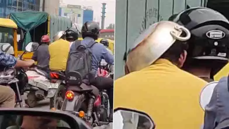 Bengaluru: चालान से बचने के लिए पीछे बैठे सवार ने सिर पर रखा फ्राइंग पैन Bengaluru: चालान से बचने के लिए पीछे बैठे सवार ने सिर पर रखा फ्राइंग पैन