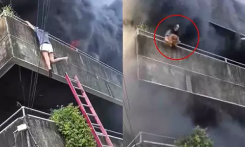 Philippines की एक महिला एक बड़ी बिल्डिंग में लगी आग में फंस गई