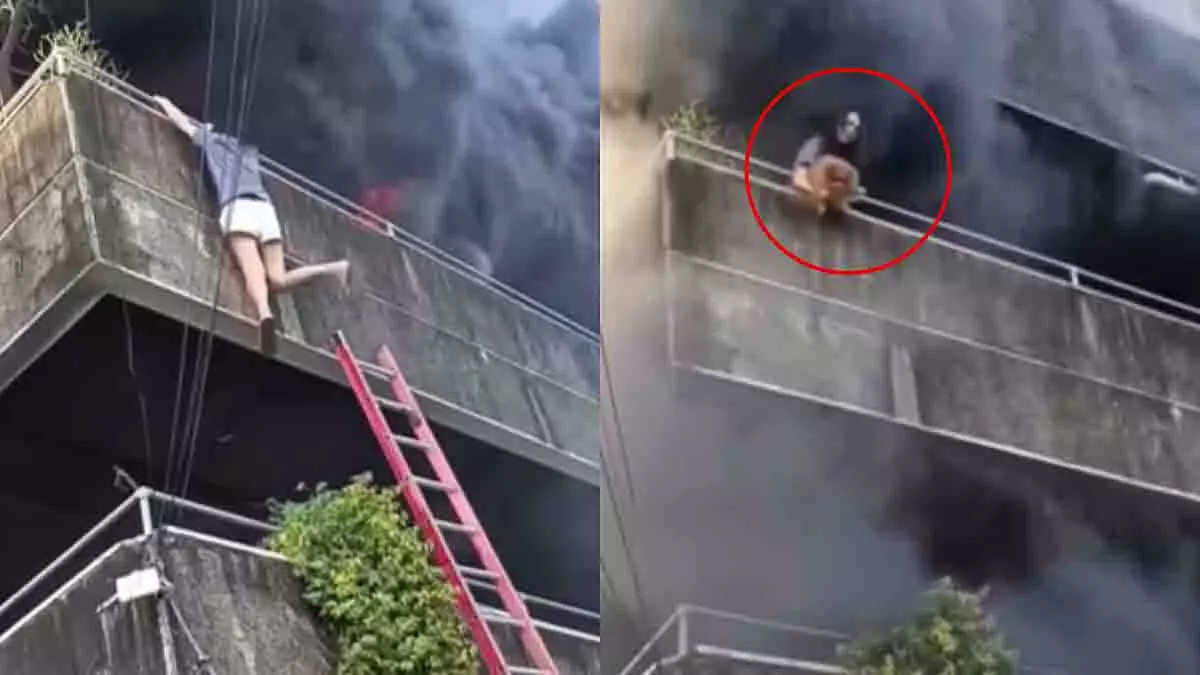 Philippines की एक महिला एक बड़ी बिल्डिंग में लगी आग में फंस गई Philippines की एक महिला एक बड़ी बिल्डिंग में लगी आग में फंस गई
