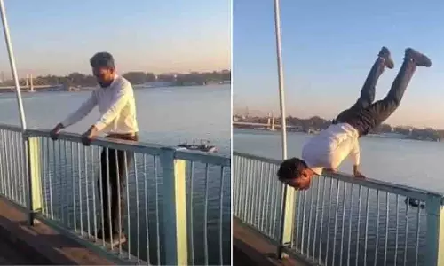 Bhopal की वीआईपी रोड पर अपर लेक के ऊपर युवक ने मयूरासन किया Bhopal की वीआईपी रोड पर अपर लेक के ऊपर युवक ने मयूरासन किया