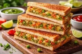 Triple Veg Sandwich Recipe: हेल्दी और टेस्टी ट्विस्ट के साथ बनाएं ट्रिपल वेज सैंडविच Triple Veg Sandwich Recipe: हेल्दी और टेस्टी ट्विस्ट के साथ बनाएं ट्रिपल वेज सैंडविच