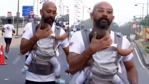 Kerala: सुपर डैड का क्यूट पल उल्टा पड़ा; कोच्चि मैराथन घटना को लेकर भारी आलोचना Kerala: सुपर डैड का क्यूट पल उल्टा पड़ा; कोच्चि मैराथन घटना को लेकर भारी आलोचना