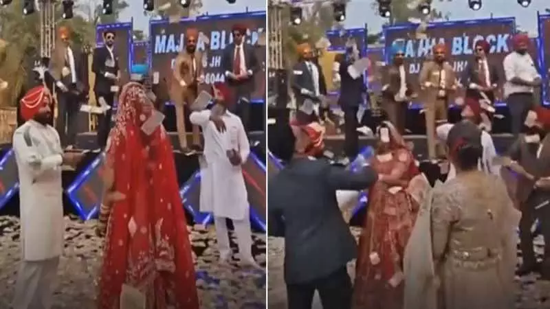 Punjab की ग्रैंड कैश वेडिंग, वायरल क्लिप में दुल्हन पर 8.5 करोड़ रुपये लुटाए गए Punjab की ग्रैंड कैश वेडिंग, वायरल क्लिप में दुल्हन पर 8.5 करोड़ रुपये लुटाए गए