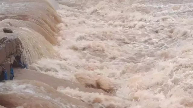 भारी बारिश के बाद देव नदी का जलस्तर बढ़ा, Udala में अस्थायी पुल डूबा भारी बारिश के बाद देव नदी का जलस्तर बढ़ा, Udala में अस्थायी पुल डूबा