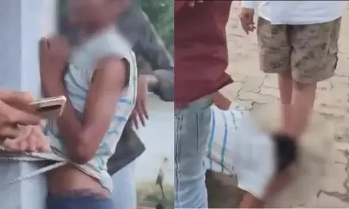 चोरी के शक में नाबालिग को पिलर से बांधकर पीटा