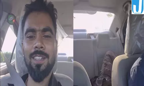 थककर सो गया कैब ड्राइवर यात्री ने संभाला स्टीयरिंग दिल जीतने वाला वीडियो वायरल